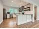 Well-lit kitchen with stainless steel appliances, a kitchen island, and hardwood flooring at 2797 Gresham Se Rd, Atlanta, GA 30316