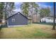 Spacious backyard featuring mature trees, level yard, and plenty of room for outdoor activities at 335 Old Airport Rd, Carrollton, GA 30116