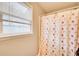 Bathroom with floral shower curtain and window at 335 Old Airport Rd, Carrollton, GA 30116