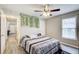 Comfortable bedroom with ceiling fan, stylish accents, and ample natural light at 335 Old Airport Rd, Carrollton, GA 30116