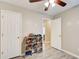 Bedroom with storage, ceiling fan and light colored walls at 335 Old Airport Rd, Carrollton, GA 30116