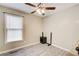 Bedroom with ceiling fan, light colored walls and a large window at 335 Old Airport Rd, Carrollton, GA 30116