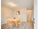 Bright dining area with wood table, seating four, leading to kitchen and hallway at 335 Old Airport Rd, Carrollton, GA 30116