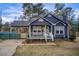Charming home featuring a cozy porch, covered parking and welcoming curb appeal at 335 Old Airport Rd, Carrollton, GA 30116