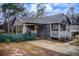 Charming home featuring a cozy front porch, carport, and well-maintained exterior at 335 Old Airport Rd, Carrollton, GA 30116