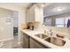 Kitchen featuring stainless steel sink, white counters and view to front room at 335 Old Airport Rd, Carrollton, GA 30116
