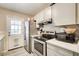 Modern kitchen featuring stainless steel appliances, light cabinets, and easy access to outdoor area at 335 Old Airport Rd, Carrollton, GA 30116