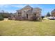 Spacious backyard with brick home, perfect for outdoor activities and relaxation at 1132 Venetian Ln, Hampton, GA 30228