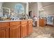 Large bathroom with double vanity, decorative mirrors, and ample counter space at 1132 Venetian Ln, Hampton, GA 30228