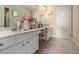 Well-lit bathroom featuring a vanity with white cabinets and tile flooring at 1132 Venetian Ln, Hampton, GA 30228