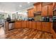 Spacious kitchen with stainless steel appliances, wood cabinets and dark countertops at 1132 Venetian Ln, Hampton, GA 30228