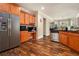 Large kitchen featuring stainless steel refrigerator, desk area and wood cabinetry at 1132 Venetian Ln, Hampton, GA 30228