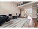 Spacious living room with hardwood floors, high ceilings, and a view of the foyer and staircase at 1132 Venetian Ln, Hampton, GA 30228