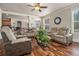 Spacious living room with hardwood floors and comfortable seating, perfect for entertaining at 1132 Venetian Ln, Hampton, GA 30228