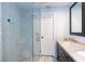 Elegant bathroom with a marble-tiled shower and granite countertop vanity at 1247 Monroe Ne Dr, Atlanta, GA 30306