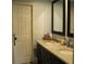 Well-lit bathroom featuring granite countertop, undermount sinks and neutral color palette at 1247 Monroe Ne Dr, Atlanta, GA 30306
