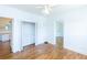 Bedroom with hardwood floors, closet and open doorway to the rest of the home at 1247 Monroe Ne Dr, Atlanta, GA 30306