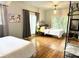 This bedroom features hardwood floors, 2 beds, and plenty of natural lighting from the large windows at 1247 Monroe Ne Dr, Atlanta, GA 30306