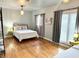 This bedroom features hardwood floors, two beds, and plenty of natural light from the large windows at 1247 Monroe Ne Dr, Atlanta, GA 30306