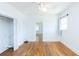This bedroom features hardwood floors, closet and open doorway to the rest of the home at 1247 Monroe Ne Dr, Atlanta, GA 30306