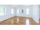 Bedroom with hardwood floors, white walls, and ample natural light at 1247 Monroe Ne Dr, Atlanta, GA 30306