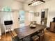 Inviting dining area featuring hardwood floors, ample natural light, and a rustic wooden dining table at 1247 Monroe Ne Dr, Atlanta, GA 30306