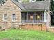 Charming stone cottage featuring a screened porch and well-maintained yard at 1247 Monroe Ne Dr, Atlanta, GA 30306