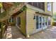 Exterior of home featuring a wood porch and multiple windows at 1247 Monroe Ne Dr, Atlanta, GA 30306