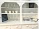 Vintage Hutch with white finish, open shelving, and plentiful storage at 1247 Monroe Ne Dr, Atlanta, GA 30306