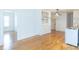 Charming kitchen featuring hardwood floors, vintage hutch, and white appliances at 1247 Monroe Ne Dr, Atlanta, GA 30306