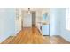 Open concept kitchen with hardwood floors, white cabinets and modern appliances at 1247 Monroe Ne Dr, Atlanta, GA 30306