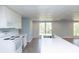 Bright kitchen features a center island with a sink at 1247 Monroe Ne Dr, Atlanta, GA 30306
