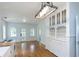Bright kitchen featuring white cabinets, modern appliances, and hardwood floors at 1247 Monroe Ne Dr, Atlanta, GA 30306