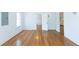 Sunlit living room with beautiful hardwood floors and neutral color scheme at 1247 Monroe Ne Dr, Atlanta, GA 30306