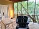 Relax on the screened porch with wooded views at 1247 Monroe Ne Dr, Atlanta, GA 30306