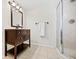 Bathroom features a dark wood vanity with a step-in shower at 3087 Meadow Lark Ln, East Point, GA 30344