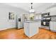 Updated kitchen with white cabinets, stainless steel appliances, and center island at 3087 Meadow Lark Ln, East Point, GA 30344