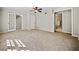 Spacious living room with neutral walls, carpet floors, and french doors at 3087 Meadow Lark Ln, East Point, GA 30344