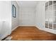 Bright walk-in closet features custom shelving and hardwood floors at 3087 Meadow Lark Ln, East Point, GA 30344