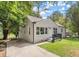 Charming single Gathering home with a well maintained lawn and a large driveway at 316 Henry Aaron Ave, Atlanta, GA 30310
