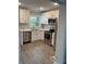 Modern kitchen featuring stainless steel appliances, white cabinetry, and stylish countertops at 316 Henry Aaron Ave, Atlanta, GA 30310