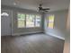 Inviting living room boasts natural light and features a modern ceiling fan at 316 Henry Aaron Ave, Atlanta, GA 30310