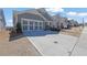 Charming home with a two-car garage, neutral paint, and concrete driveway, with a landscaped yard at 814 Spruce Ave, Canton, GA 30114