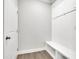 Mudroom boasts a built in bench with cubbies, hooks, and coat closet for optimal organization and storage at 814 Spruce Ave, Canton, GA 30114