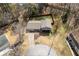 An aerial view of a well-maintained home, fenced backyard and circular driveway at 2690 Manassas Pl, Snellville, GA 30039