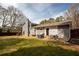 Large fenced backyard with a patio, grill, and ample space for outdoor activities at 2690 Manassas Pl, Snellville, GA 30039