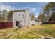 A spacious fenced backyard includes a patio with furniture and some landscaping at 2690 Manassas Pl, Snellville, GA 30039