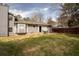 Exterior home elevation featuring a fenced backyard with an outdoor seating area at 2690 Manassas Pl, Snellville, GA 30039
