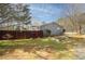 Fenced backyard featuring a garden and lush green grass at 2690 Manassas Pl, Snellville, GA 30039