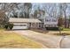 Charming two-story home featuring a well-maintained front yard with established landscaping at 2690 Manassas Pl, Snellville, GA 30039